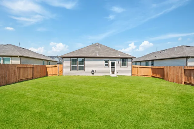 a view of a yard in front of a house
