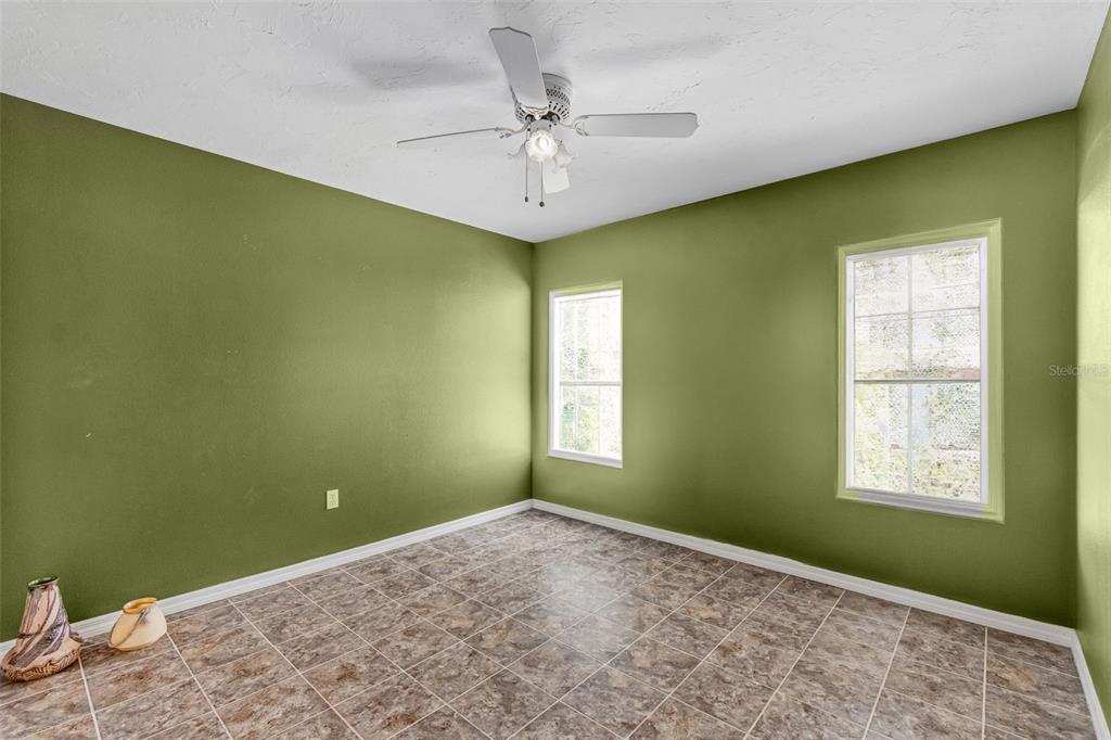 119 Burns Road Terra Ceia, FL 34250 - Photo 60 of 100 an empty room with a window and a ceiling fan