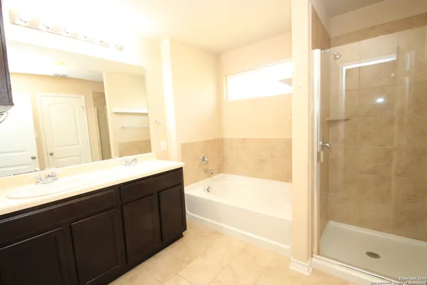a bathroom with a bathtub and a sink