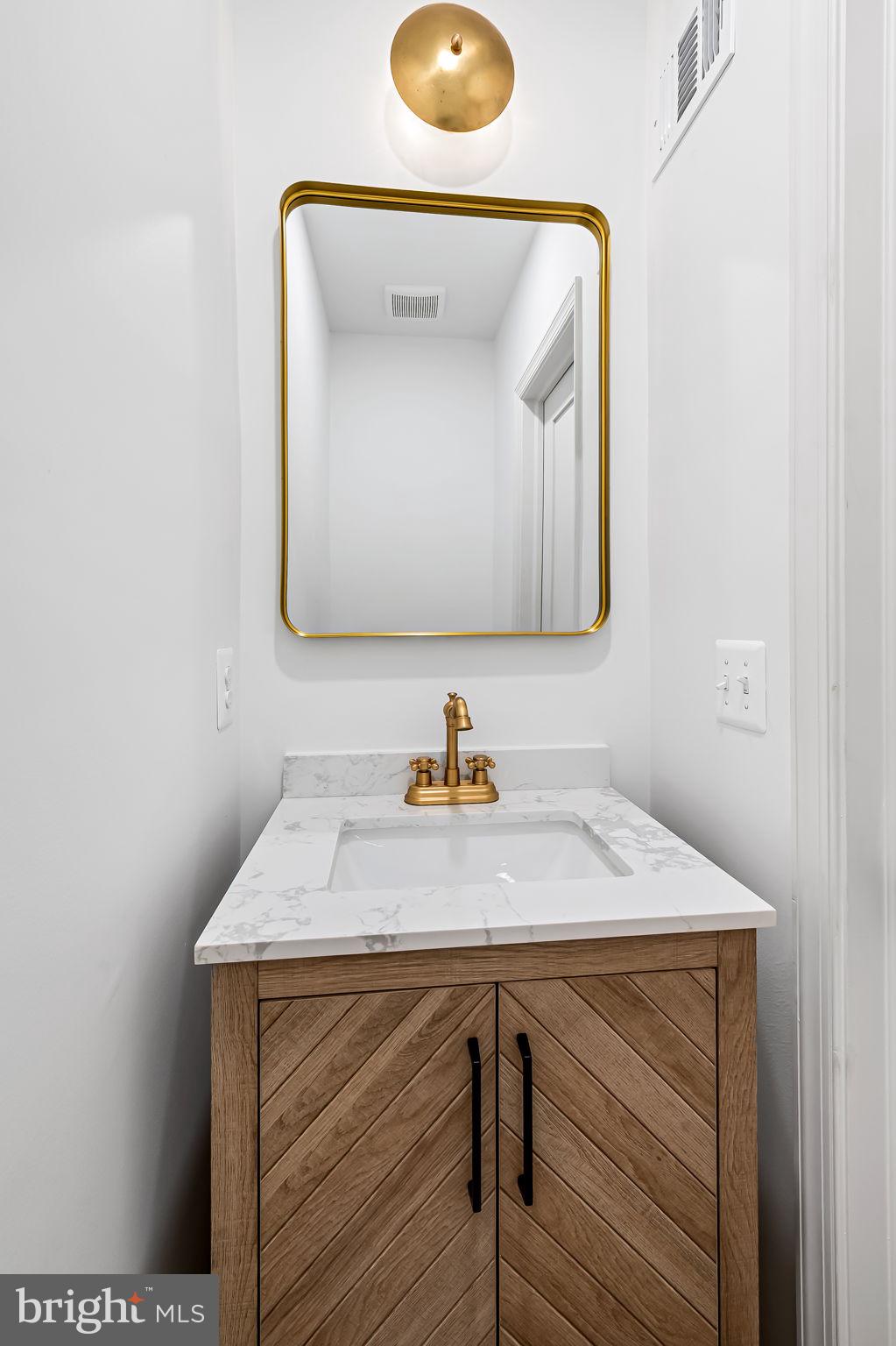 3539 Roland Avenue Baltimore, MD 21211 - Photo 11 of 31 First floor half bathroom