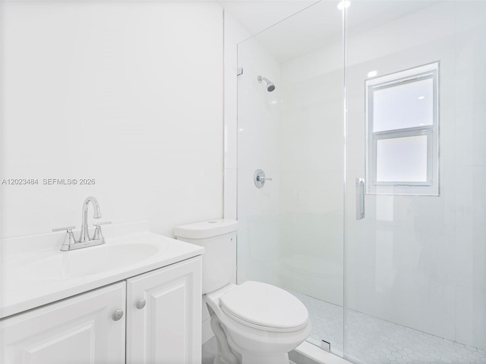 1961 Rutland Street Opa-Locka, FL 33054 - Photo 11 of 33 a bathroom with a sink a toilet and shower