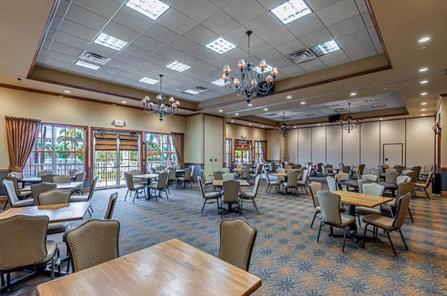 a living room with furniture and a lamp