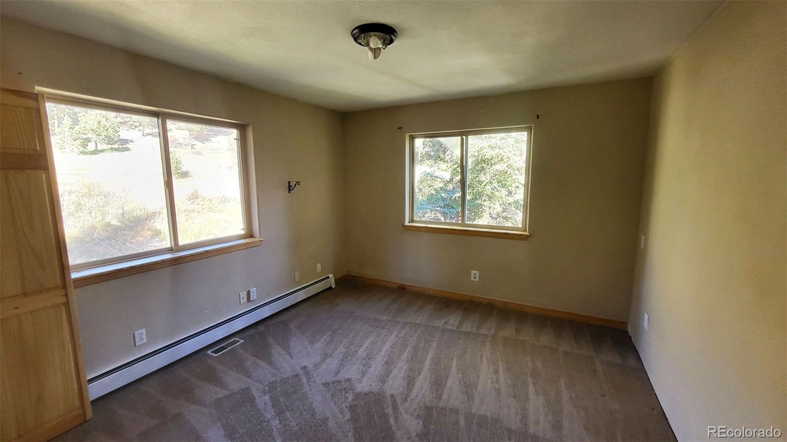 294 Red Tail Trail Evergreen, CO 80439 - Photo 13 of 35 a view of an empty room with a window