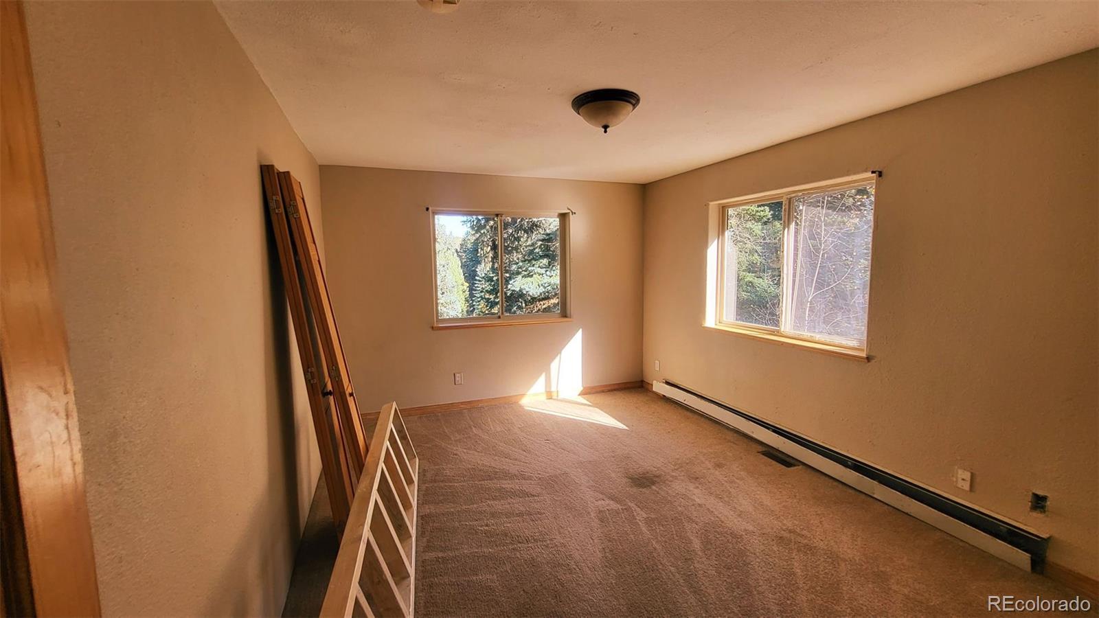 294 Red Tail Trail Evergreen, CO 80439 - Photo 14 of 35 a view of an empty room with windows