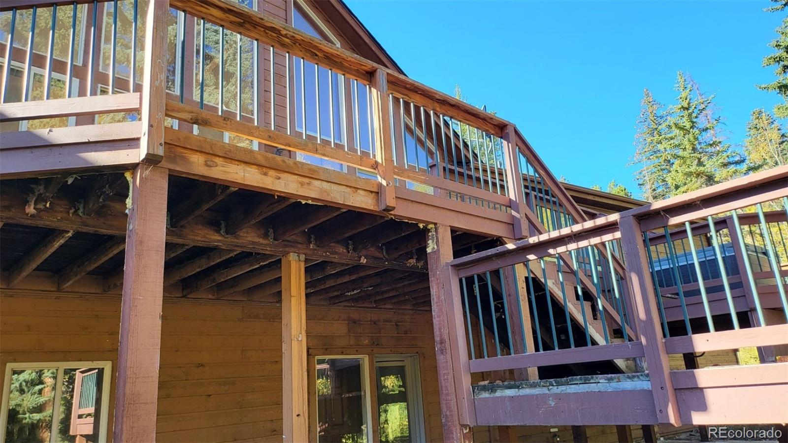294 Red Tail Trail Evergreen, CO 80439 - Photo 17 of 35 a view of a house with wooden stairs