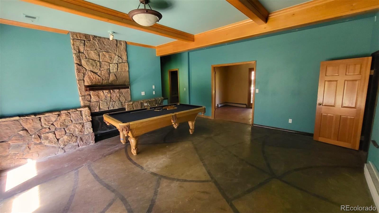 294 Red Tail Trail Evergreen, CO 80439 - Photo 26 of 35 a backyard of a house with barbeque oven table and chairs