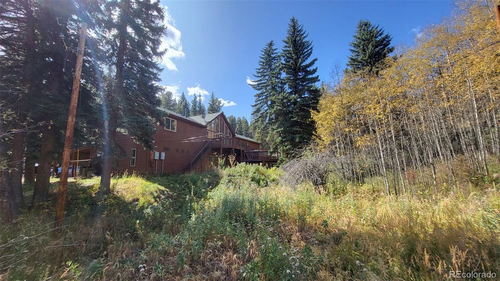 294 Red Tail Trail Evergreen, CO 80439 - Photo 33 of 35 a view of a yard of a house