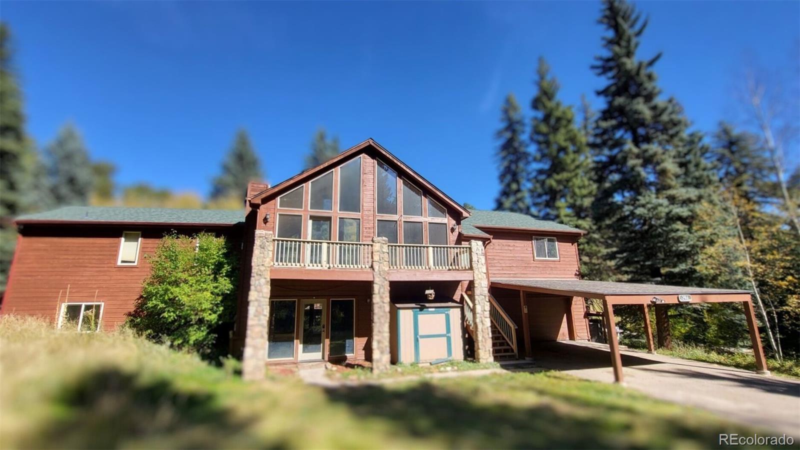 294 Red Tail Trail Evergreen, CO 80439 - Photo 35 of 35 a front view of a house with a porch