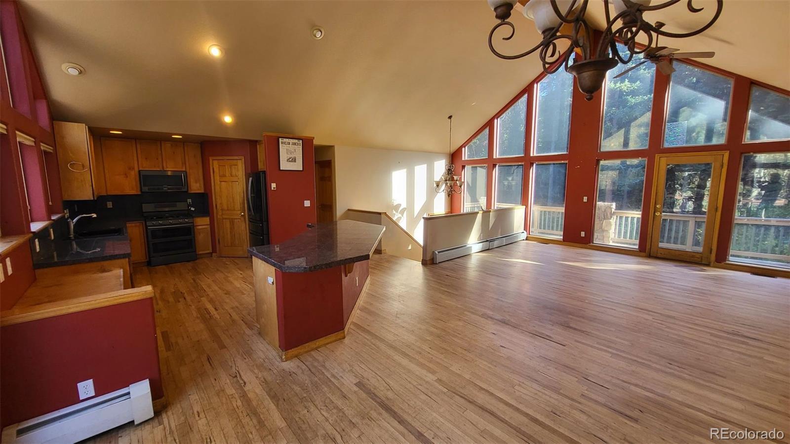 294 Red Tail Trail Evergreen, CO 80439 - Photo 4 of 35 a view of a living room with furniture and a large window
