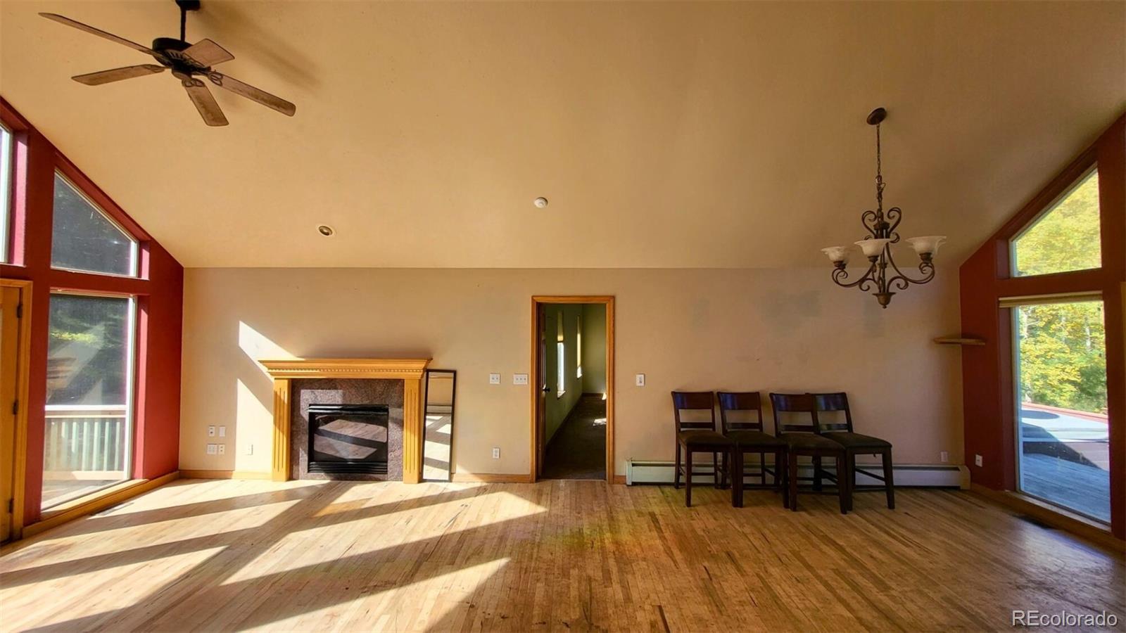 294 Red Tail Trail Evergreen, CO 80439 - Photo 6 of 35 a view of livingroom with furniture and a fireplace