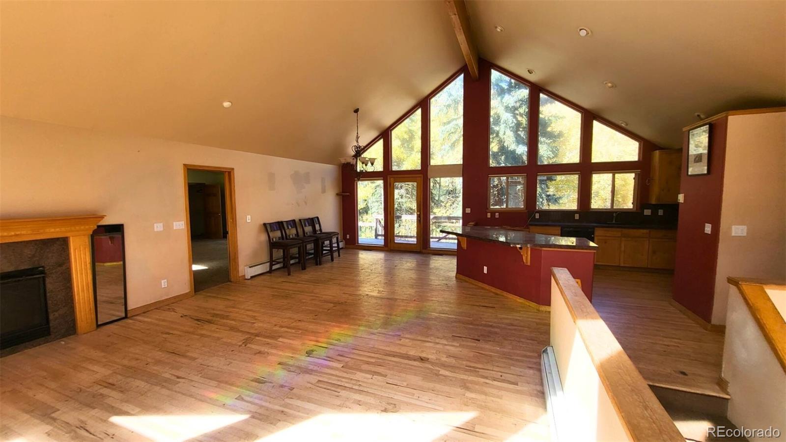 294 Red Tail Trail Evergreen, CO 80439 - Photo 8 of 35 a lobby with furniture and floor to ceiling window
