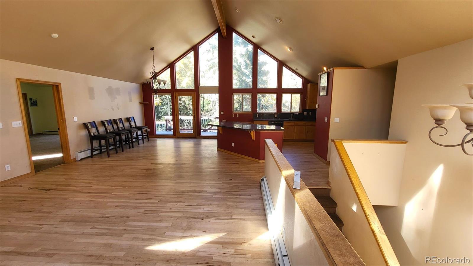 294 Red Tail Trail Evergreen, CO 80439 - Photo 10 of 35 a view of a living room and dining room