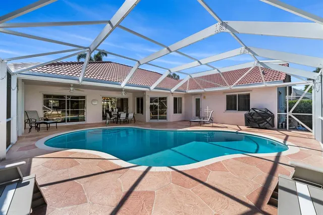 a view of swimming pool with seating area