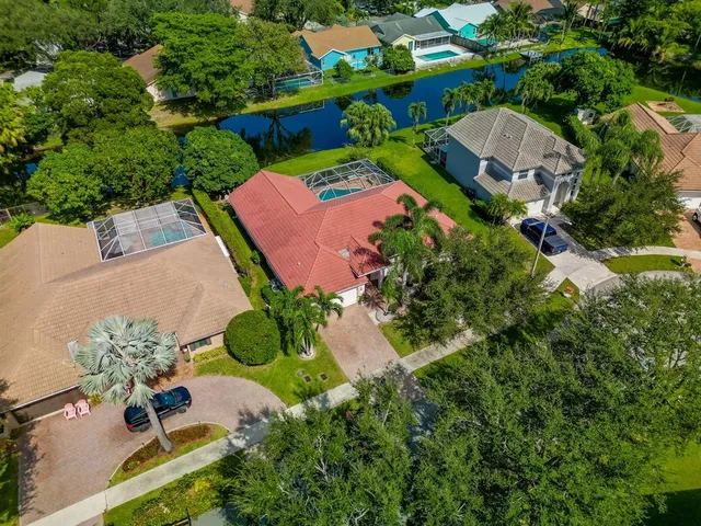 an aerial view of a house with yard