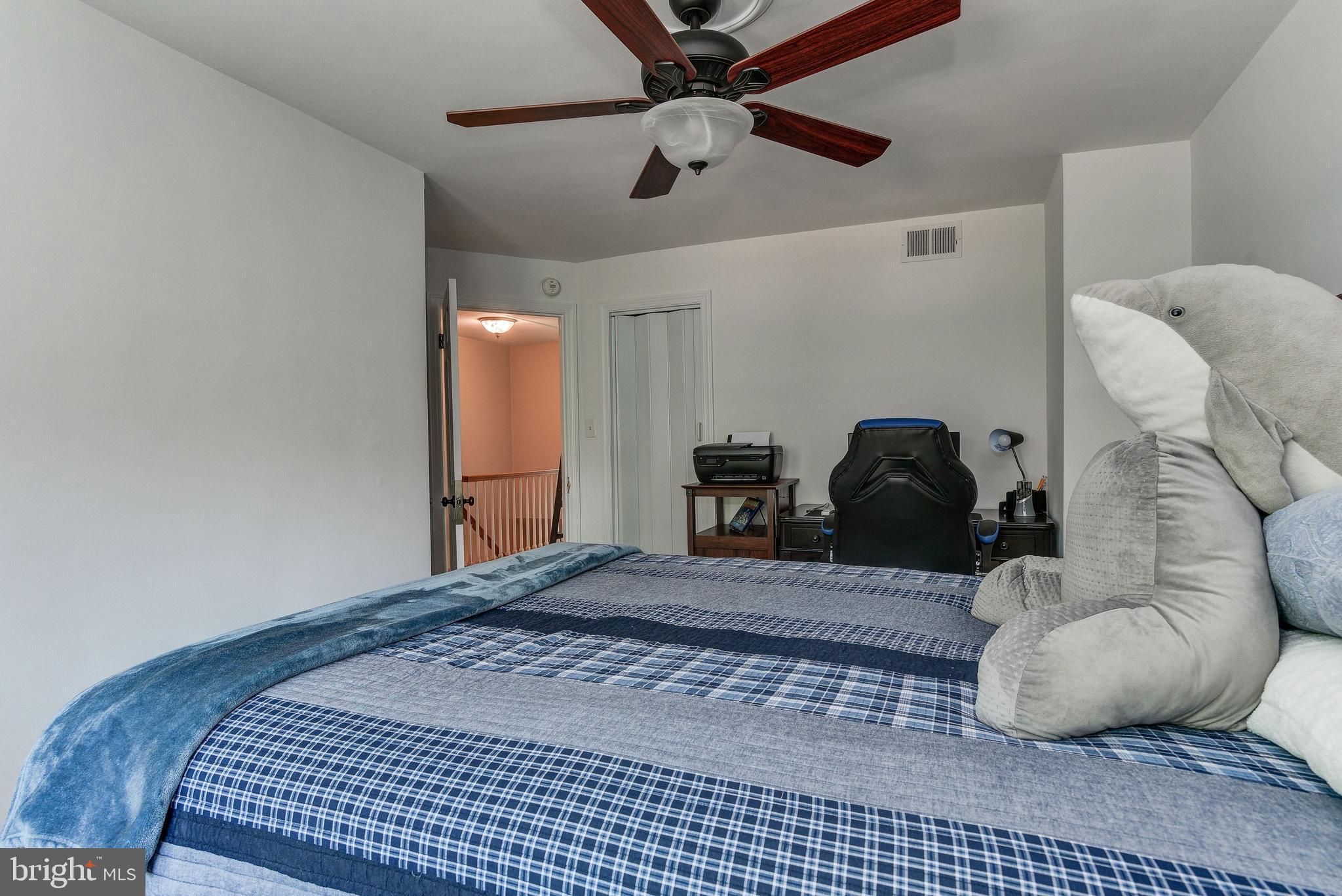 506 Academy Road Baltimore, MD 21228 - Photo 28 of 49 a bedroom with a bed and window