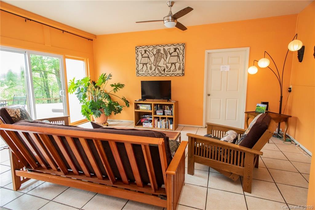 84 Brahma Ridge Candler, NC 28715 - Photo 11 of 30 a living room with furniture and a flat screen tv