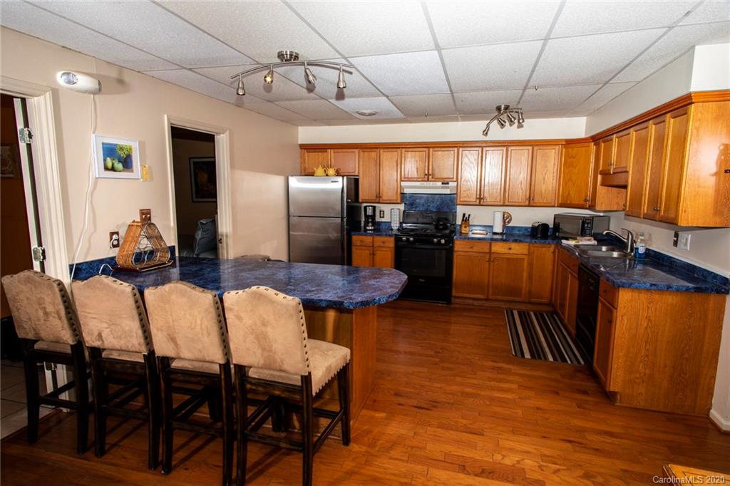 84 Brahma Ridge Candler, NC 28715 - Photo 12 of 30 a view of a dining room with furniture window and wooden floor