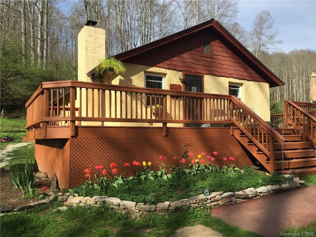 84 Brahma Ridge Candler, NC 28715 - Photo 13 of 30 a view of a house with backyard and sitting area