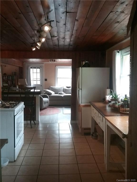 84 Brahma Ridge Candler, NC 28715 - Photo 16 of 30 a kitchen with a sink a counter top space appliances and cabinets
