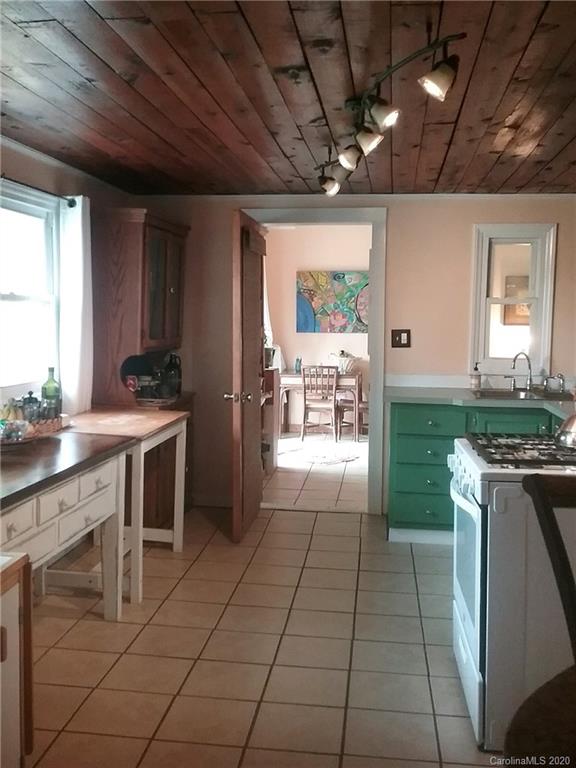 84 Brahma Ridge Candler, NC 28715 - Photo 17 of 30 a kitchen with stainless steel appliances granite countertop a stove a sink and a refrigerator