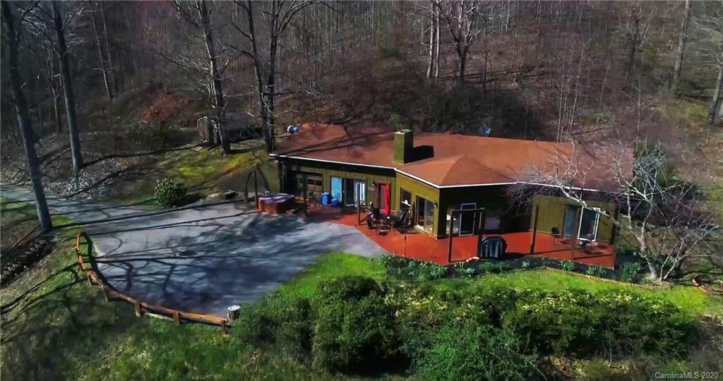 84 Brahma Ridge Candler, NC 28715 - Photo 5 of 30 an aerial view of a house with swimming pool big yard and large trees