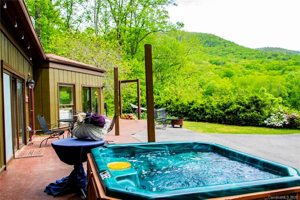 84 Brahma Ridge Candler, NC 28715 - Photo 6 of 30 a view of swimming pool in the backyard of house along with seating space