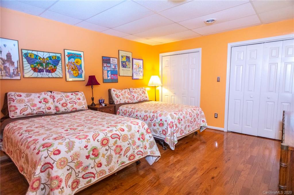 84 Brahma Ridge Candler, NC 28715 - Photo 9 of 30 a bedroom with two beds and painting on the wall