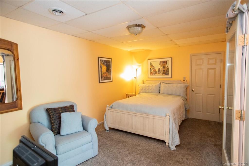 84 Brahma Ridge Candler, NC 28715 - Photo 10 of 30 a bedroom with a bed and couch