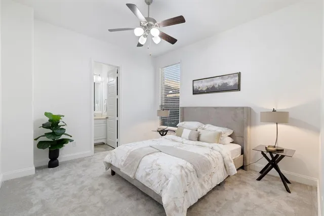 a bathroom with a granite countertop sink toilet mirror and shower