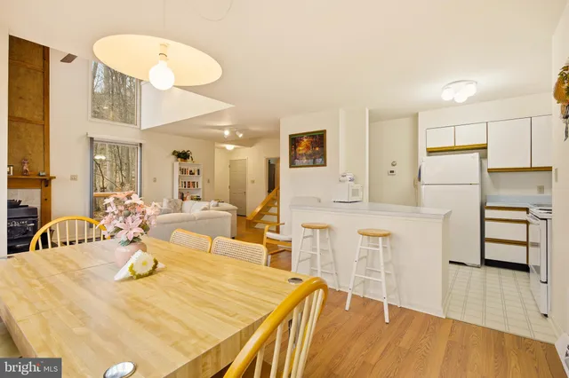 a very nice looking dining room with a table and chairs