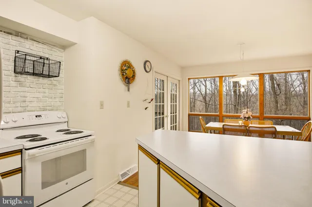 a kitchen with a stove and a sink