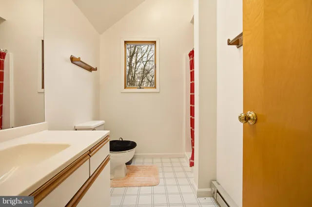 a bathroom with a toilet and a sink