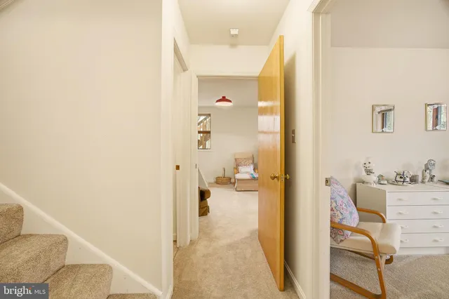 a spacious bedroom with a bed and a couch