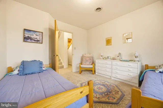 a bathroom with a granite countertop shower and a toilet