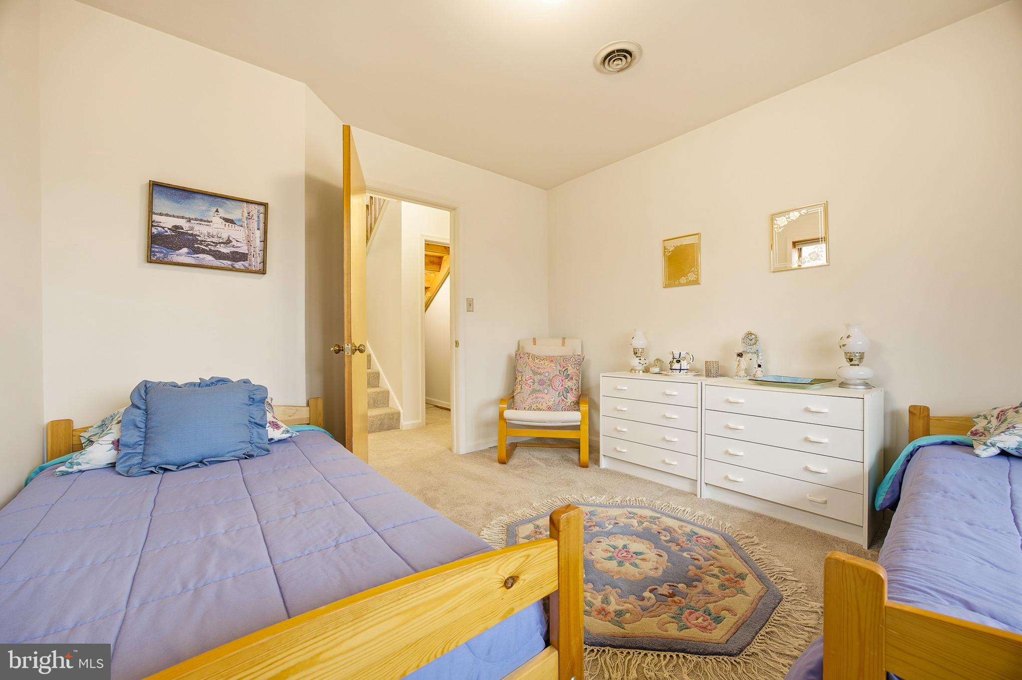 16 Gopher Trail Berkeley Springs, WV 25411 - Photo 40 of 52 a bedroom with a bed and wooden floor