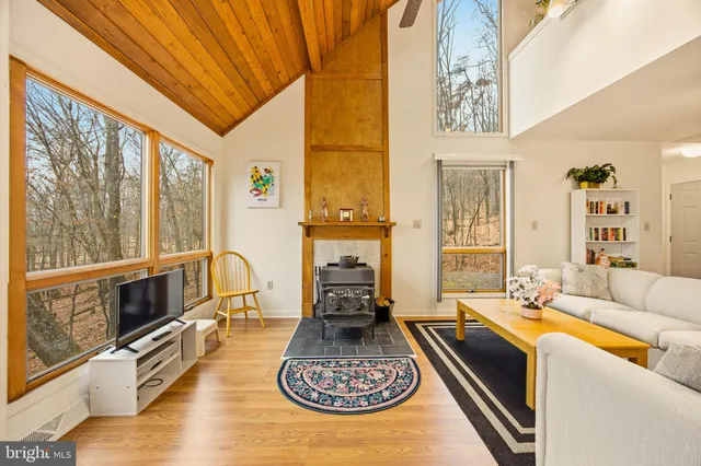 a living room with furniture large window and couch