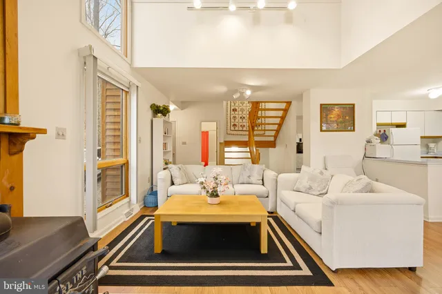a living room with furniture and a table