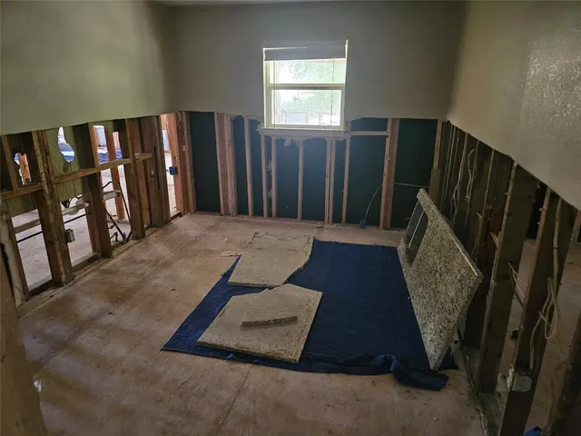 a view of a hallway with windows