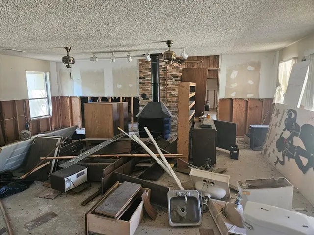 a room with gym equipment and windows