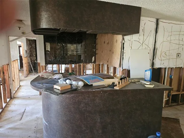 a table with chairs and a stove