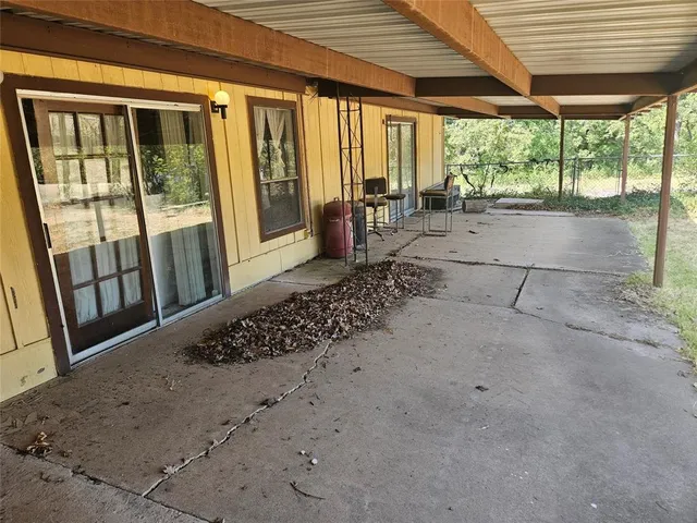a view of a porch with wooden floor and outdoor space