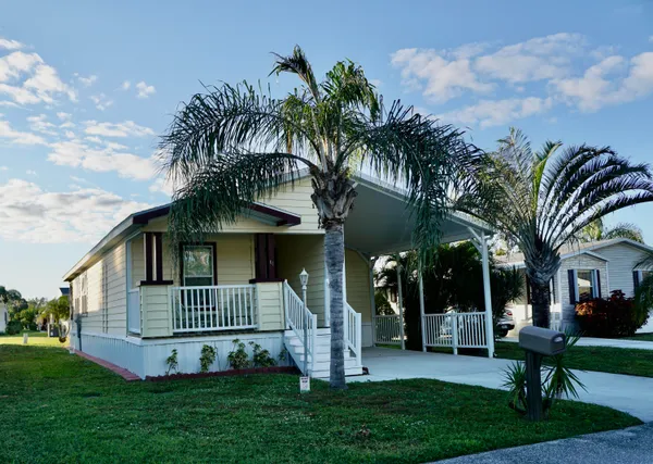 front view of a house with a yard