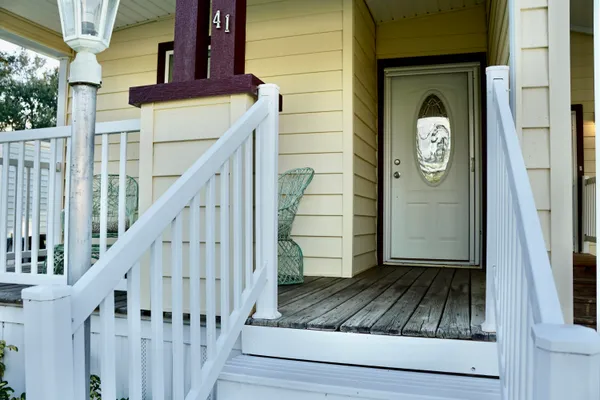 a view of entryway door with wooden floor