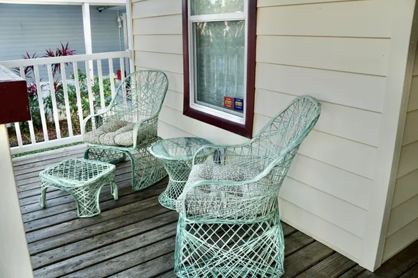 a view of balcony with furniture