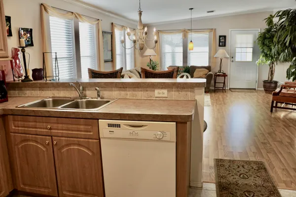 a kitchen with a sink and a refrigerator