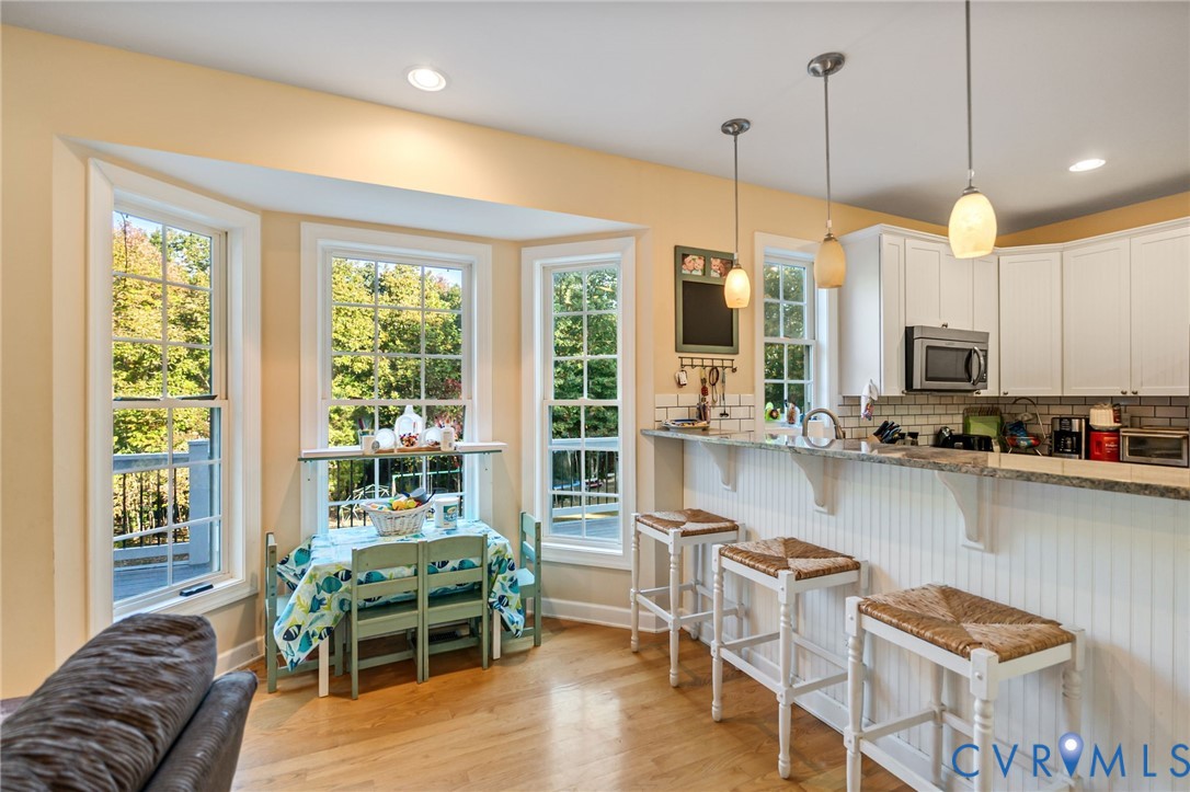 338 Thessalonia Road Bremo Bluff, VA 23022 - Photo 11 of 50 a dinning room filled with furniture and large windows