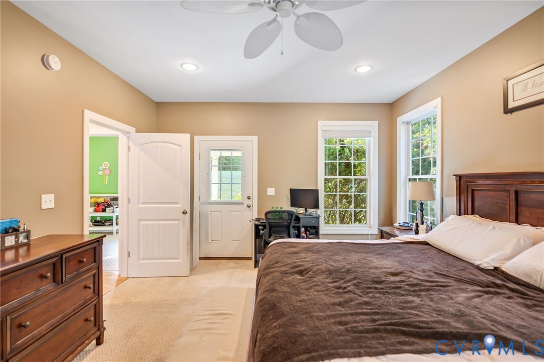 338 Thessalonia Road Bremo Bluff, VA 23022 - Photo 18 of 50 a bedroom with a bed large window and furniture