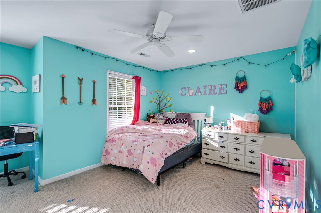 338 Thessalonia Road Bremo Bluff, VA 23022 - Photo 26 of 50 a bedroom with a bed and a chandelier