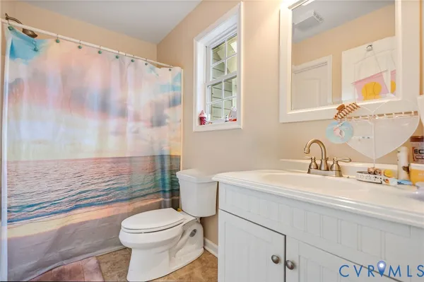 a bathroom with a sink a toilet and a bathtub