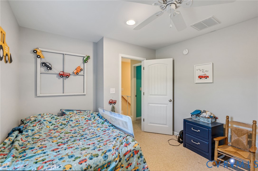 338 Thessalonia Road Bremo Bluff, VA 23022 - Photo 32 of 50 a bedroom with a bed and a chandelier